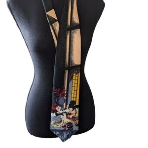 Disney tie polyester made in Canada.  Mickey and Minnie dancing